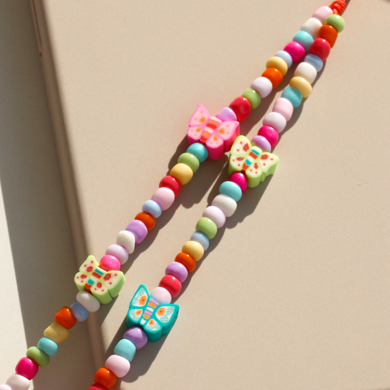 Butterflies dancing in a sun-kissed garden - Phone Charm
